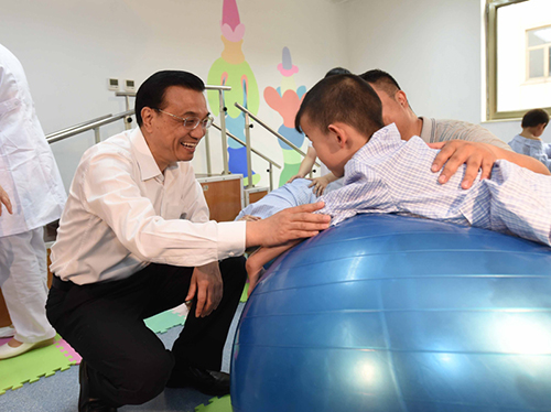 這三年，總理牽掛的殘疾人群體，迎來哪些暖政？