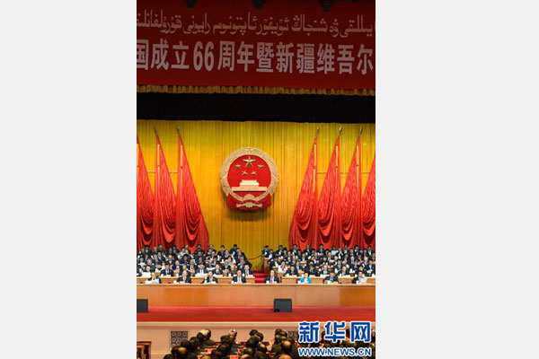 10月1日，慶祝中華人民共和國成立66周年暨新疆維吾爾自治區(qū)成立60周年大會在新疆人民會堂隆重舉行。 新華社記者 高潔 攝 